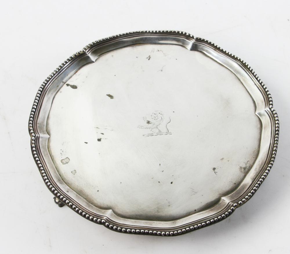 18thC English Silver Footed Salver: 18th century English silver footed salver with engraved lion in center, hallmarked for Robery Jones and John Scofield, London, 1777-78, 8 1/8" diameter, approximately 11.6 troy oz TW. Provenance: From