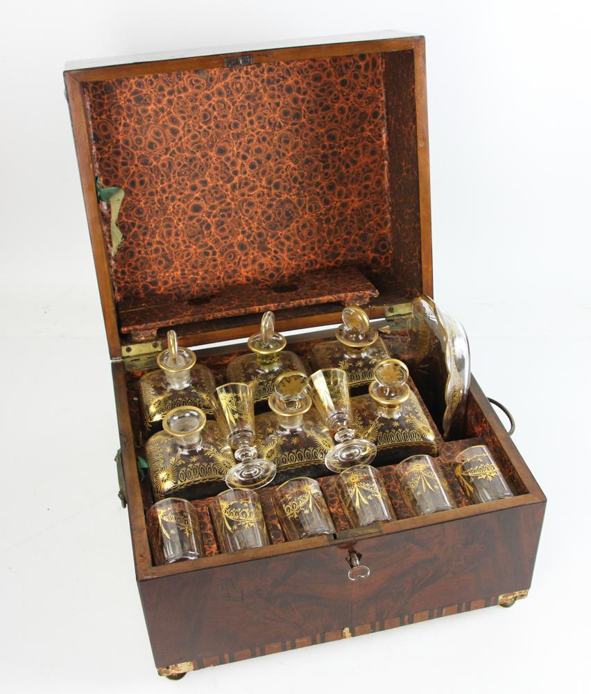 English Mahogany Liquor Chest: Exceptional English mahogany liquor chest complete with gold decorated glasses, 9" x 12 1/2" x 10".
