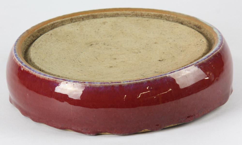Chinese Red Glazed Inkstone: Chinese red-glazed inkstone, 10" diameter. Provenance: Georgia estate.
