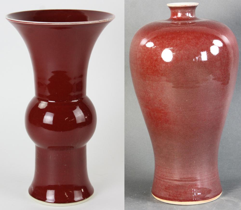 Chinese Ox Blood Red Glazed Gu Vase and Mei Vase: Chinese ox-blood red-glazed Gu vase, 14" H, and large red-glazed Mei shaped vase, 16" H. Provenance: Georgia estate.
