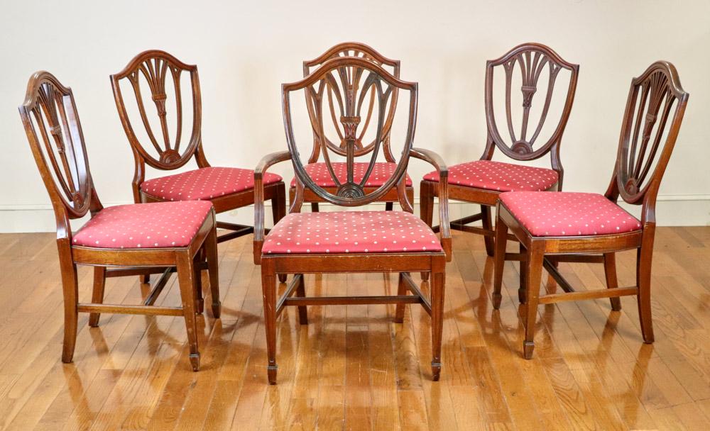 Six Circa 1900 Hepplewhite Dining Chairs: Set of six (6) Circa 1900 Hepplewhite-style dining chairs to include one (1) armchair, five (5) side chairs, armchair 39" H x 24 1/2" W x approximately 20" D. Provenance: Essex, Massachusetts collecti