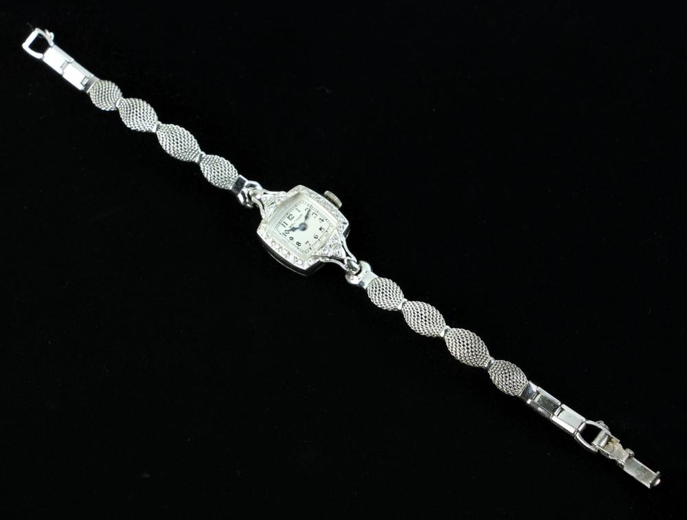 Waltham Ladies 14k White Gold and Diamond Watch: Waltham ladies' 14k white gold and diamond watch, non-gold band, approximately 12 grams TW (including band), 5/8" diameter face, 6" band. Provenance: From a Marblehead, Massachusetts estate. PLEASE NO