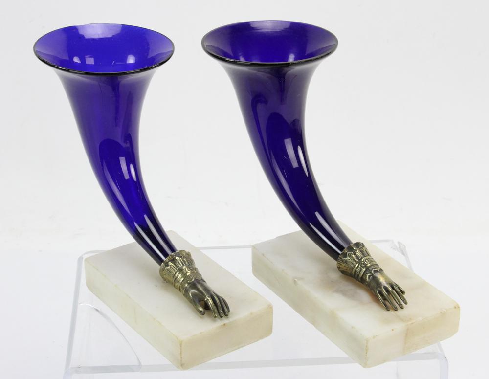 Trumpet Shaped Glass Vases Set in Bronze Hands: Pair of 19th century cobalt glass trumpet-shaped vases set in bronze figural hands, mounted on marble bases, 6 3/4" H x 8 1/2" L x 3 3/4" D. Provenance: North Andover, Massachusetts collection.
