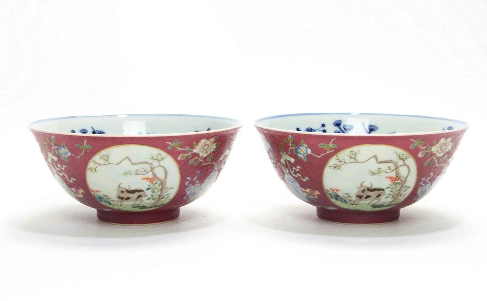 A Fine Pair of Famille Rose Medallion Bowls: A fine pair of Famille Rose purple-ground medallion bowls, the rounded sides painted to the exterior with three medallions enclosing tree and goats, within three medallions divided by foral sprays and