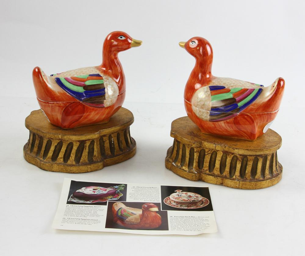 Mottahedeh Covered Ducks on Stands: Mottahedeh covered ducks on wood stands, with book "The Nelson Rockefeller Collection" in which the ducks are pictured, 6" x 7". Provenance: Estate of Alfreda Rochelle-Thomas, Palm Beach, Florida.