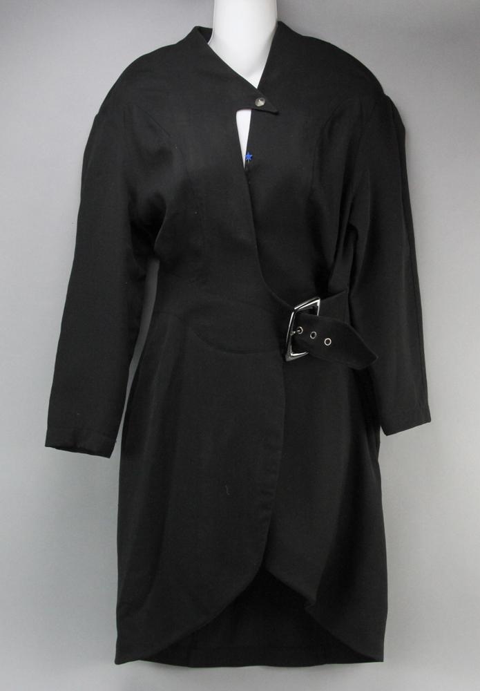 Vintage Thierry Mugler Black Wool Dress: Vintage Thierry Mugler black wool wrap dress with signature TM belt buckle, Made in France, size 10 US, small hole from brooch. Provenance: Boston, Massachusetts collection.