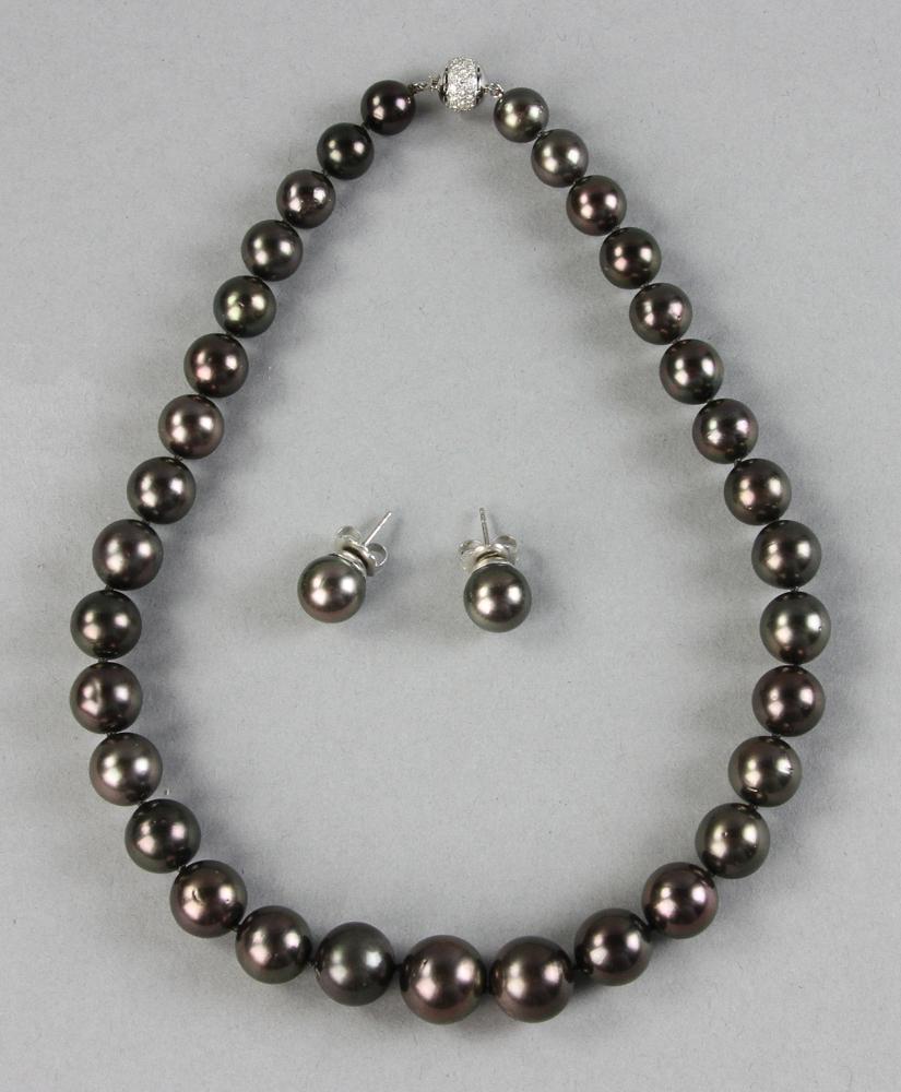 Black South Sea Tahitian Pearl Necklace and Matching: Black South Sea Tahitian graduated pearl necklace with 18k white gold and diamond clasp, thirty-three (33) lustrous, silvery black pearls 10.0 to 14.3mm, 16 1/2" L, together with matching 11.5mm black