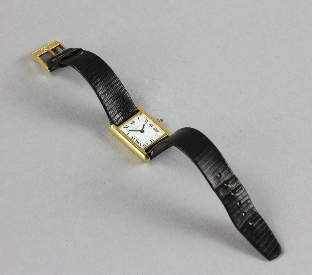 Cartier Manual Wind Wristwatch: Cartier manual-wind wristwatch with gold-plated case, leather strap marked 'Cartier', case 1" x 3/4", together with original Cartier case. Provenance: Beverly, Massachusetts collection. PLEASE NOTE: p