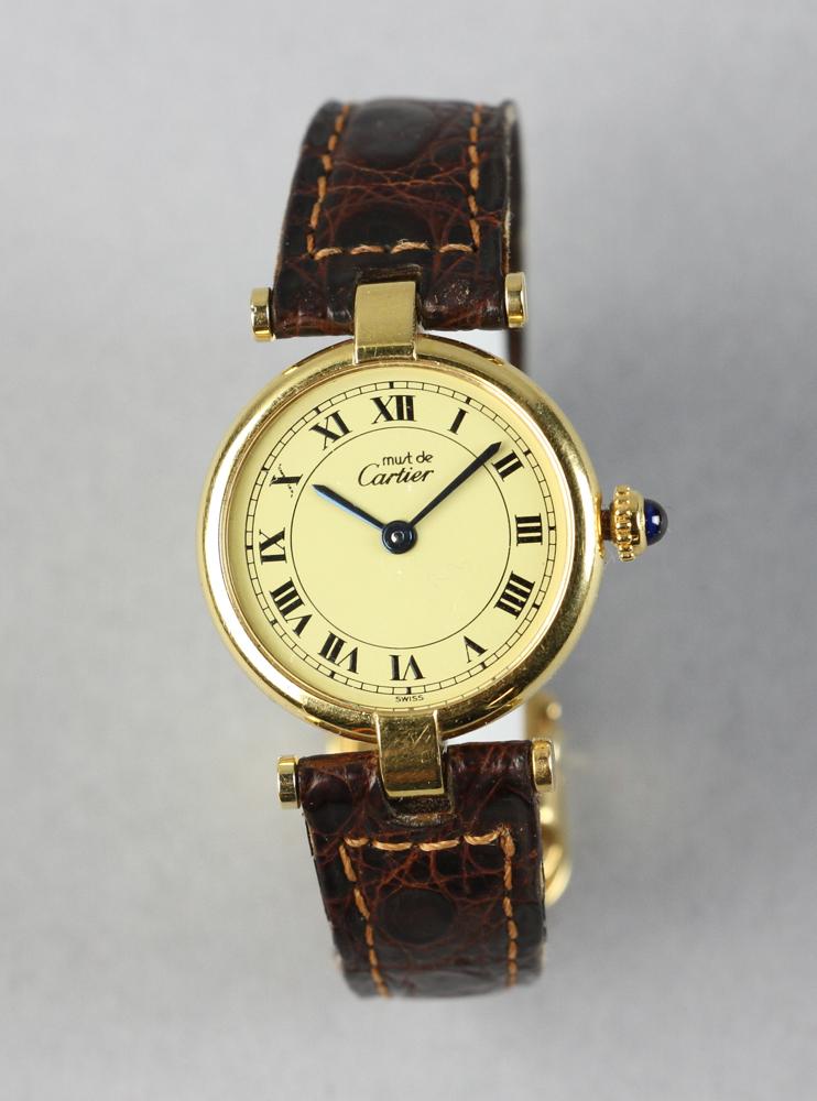 Cartier 'Must de Cartier' Wristwatch: Cartier 'Must de Cartier' wristwatch, sterling with vermeil, original Cartier alligator-style wrist band with stainless steel buckle, case 1" diameter. Provenance: Beverly, Massachusetts collection. P
