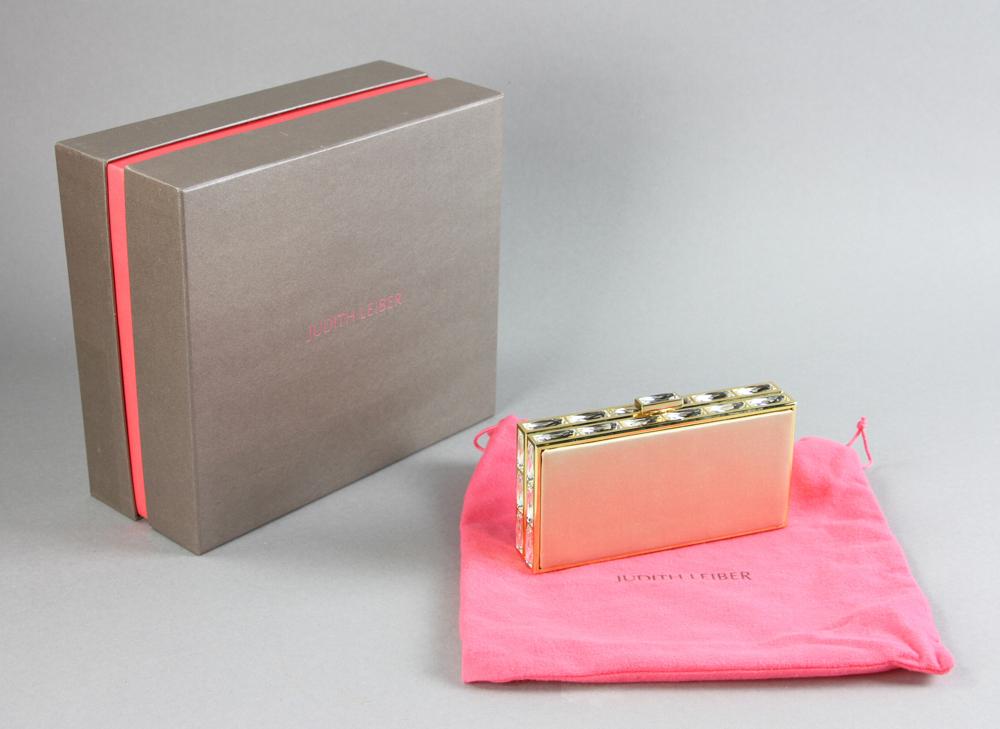 Judith Leiber Crystal and Silk Clutch: Judith Leiber crystal and silk clutch, 3" H x 6" W x 1 1/4" D. With original box.