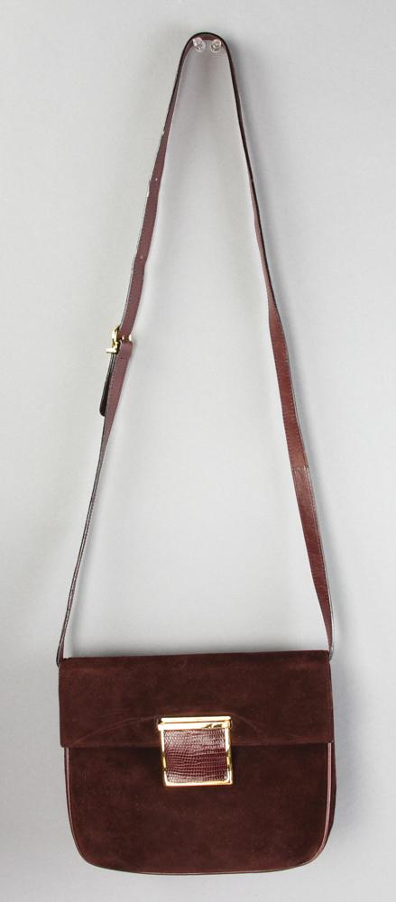 Ferragamo Maroon Suede Handbag: Salvatore Ferragamo maroon suede handbag having a snake skin medallion, 7 1/4" H x 9" W x 3" D, drop 17-20" (adjustable strap).