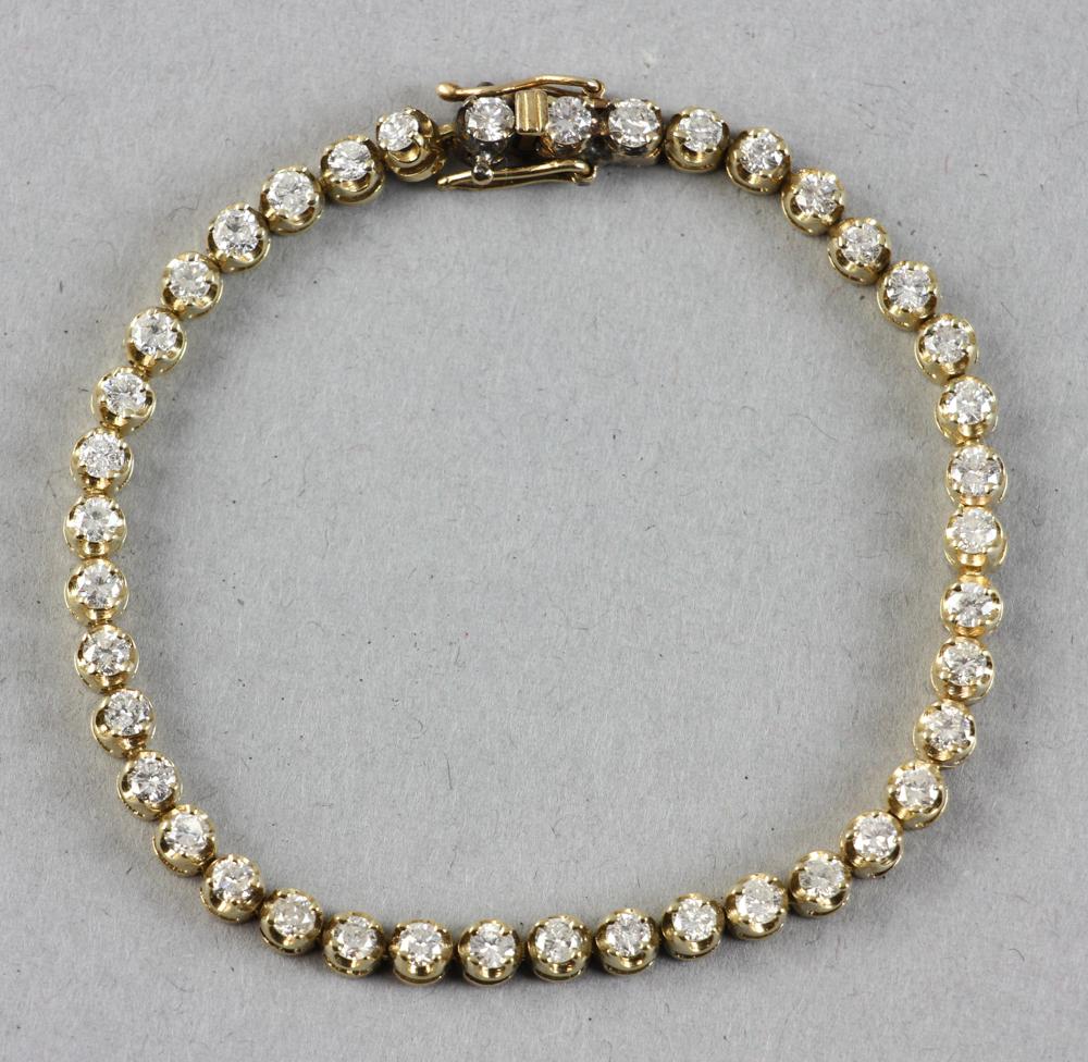 14K Yellow Gold and Diamond Bracelet: 14k yellow gold and diamond tennis bracelet, forty-one (41) diamonds, 7" L, approximately 2.5 CTW, approximately 12 grams TW. Provenance: Beverly, Massachusetts collection. PLEASE NOTE: payment for si