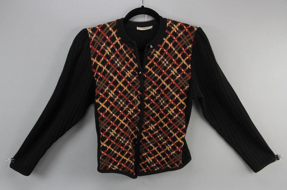 Vintage Saint Laurent Rive Gauche Cardigan: Vintage Saint Laurent Rive Gauche, made in France, pure wool black-ribbed cardigan with orange, brown and gold patterned front, size 44. Provenance: Boston, Massachusetts collection.