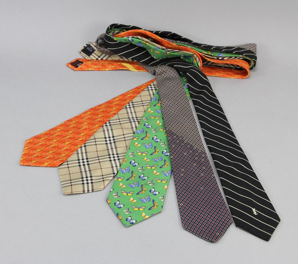 Five Designer Ties: Group of five (5) ties, to include: Burberry, Ferragamo, two Yves Saint Laurent. Provenance: From a Montecito, California estate.