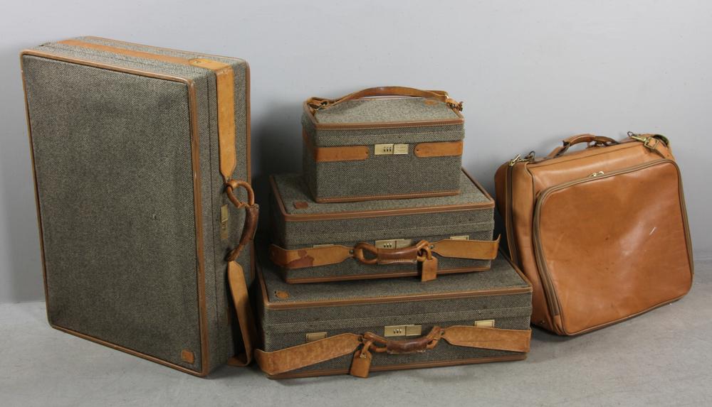 Five Hartmann Luggages: Five (5) Hartmann luggages, to include: one leather and tweed cosmetic case, two leather and tweed hardside leather suitcases, one leather and tweed overnight bag, one leather folding garment bag, lar