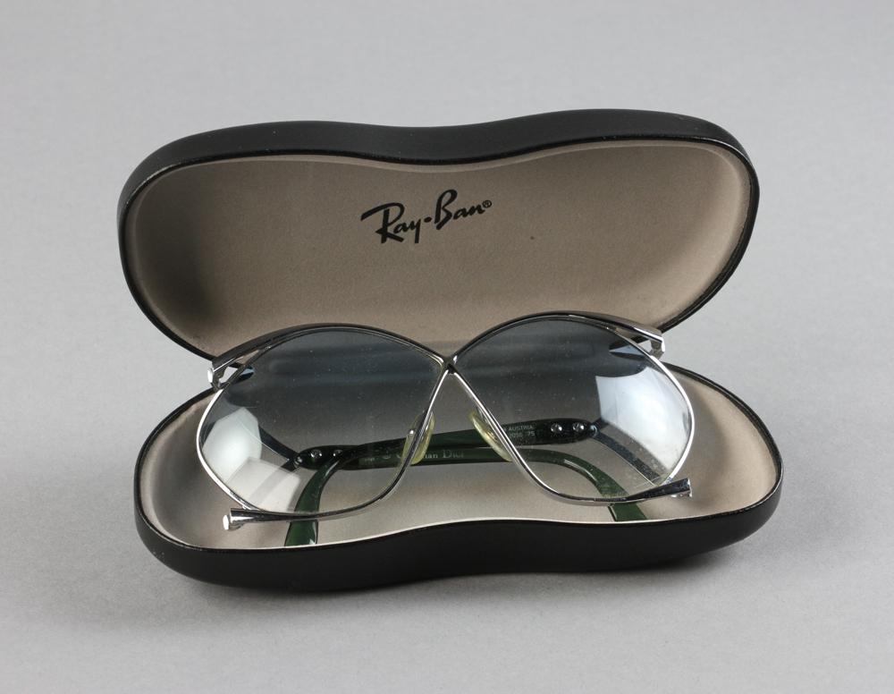Christian Dior Sunglasses: Christian Dior metal-framed sunglasses with blue-tinted lenses, new without tag. Provenance: Boston, Massachusetts collection.