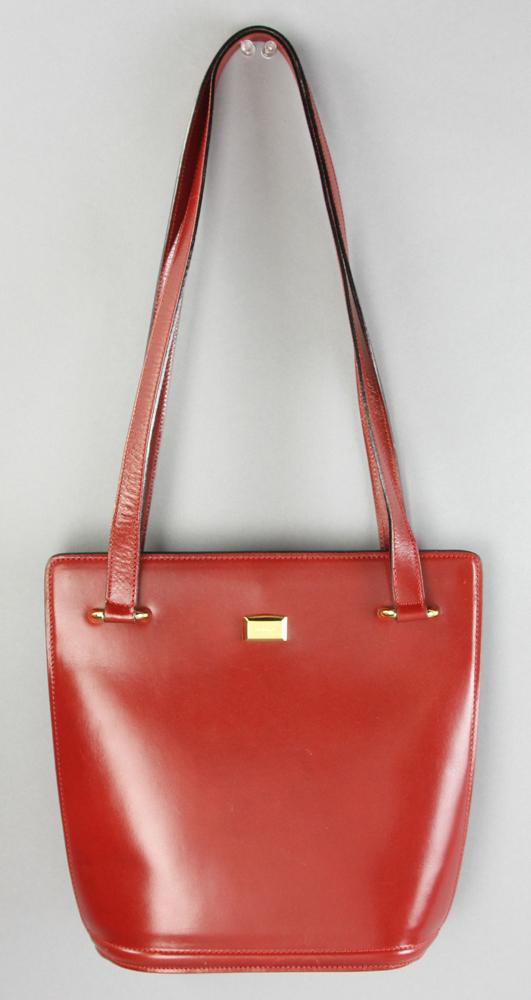 Bally Burgundy Leather Handbag: Bally burgundy leather handbag, 10 1/2" H x 10" W x 4" D, drop 12 1/2".