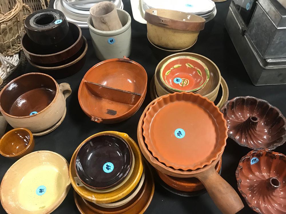 Redware and Antique Stoneware Pottery: Assorted redware and antique stoneware pottery, including mixing bowls, plates, cake molds, etc.