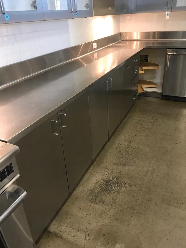 L Shape Stainless Steel Counter: L-shape stainless steel counter, 36 1/2" H x 148" W x 27" D; with double sink and GE dishwasher and grease trap, 36 1/2" H x 129" W x 27" D. To be picked up at the Starrett Lehigh building, 601 West 2