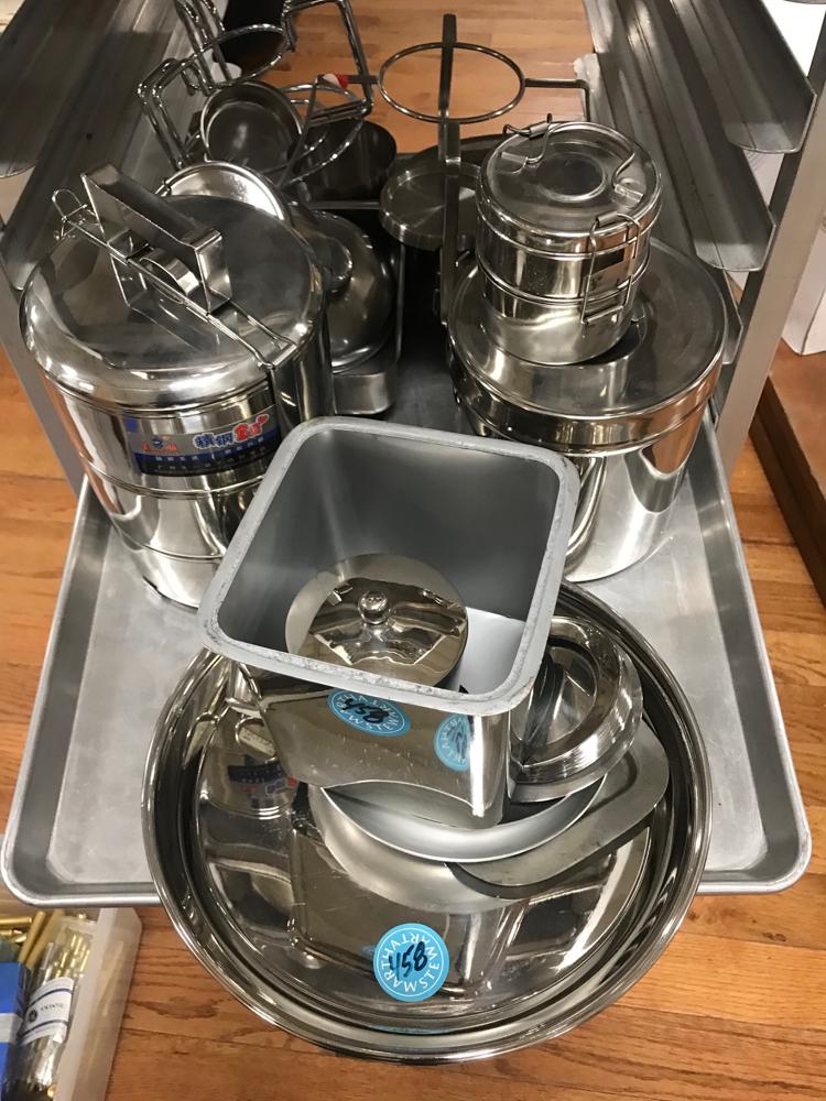 Collection of Stainless Steel Pans, Bowls, Etc: Large collection of stainless steel roasting pans, mixing bowls, china cap strainer, pie pans, cheese grater, canisters and racks.