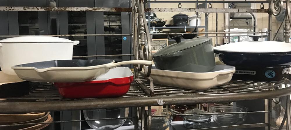 Cast Iron Enameled Items: Collection of cast iron enameled serving trays, sauce pots, skillet, Lecreuset.