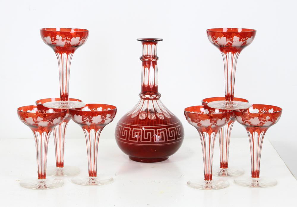 Bohemian Red Cut Wine Glasses and Decanter: Eight (8) Bohemian red cut to clean wine glasses with decanter. Provenance: From Dr. Supat of Fairfield, Connecticut.