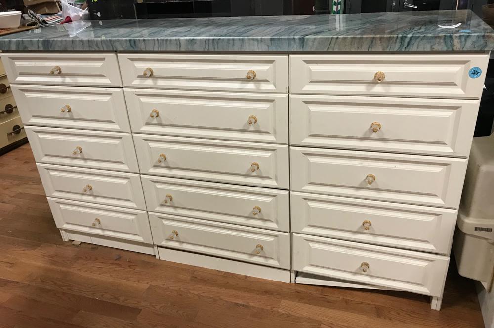 Custom Made Chest: Custom made chest having fifteen drawers and a green onyx top. Drawer knobs were made by Cheryl Wagner, 48" H x 86" W x 27" D. Provenance: Studio Props of Martha Stewart.