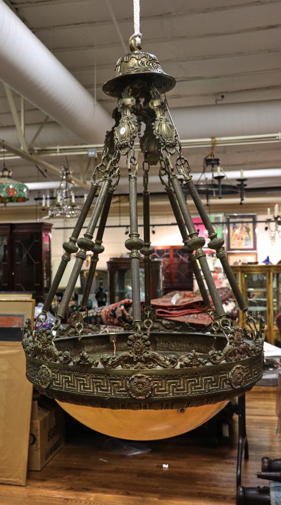 Alabaster and Bronze Chandelier: Alabaster and bronze chandelier, alabaster shade, bronze mounting ring and hangers, approximately 43 1/4" H x 33 1/2" diameter. Provenance: From a Medford, Massachusetts estate.