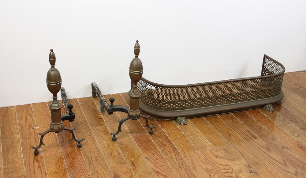Pair of American Brass Andirons: Pair of American double lemon-top brass andirons, with reticulated fender, 7 1/2" H x 33 1/2" W x 14" D.