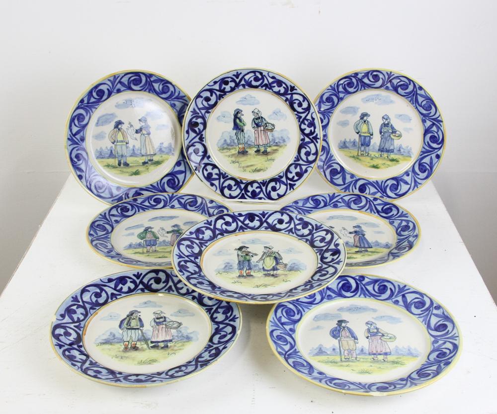 Quimper French Porcelain Dishes: Quimper French hand-painted porcelain dishes, set of (12), 8 1/4" diameter, (7) having small chips.