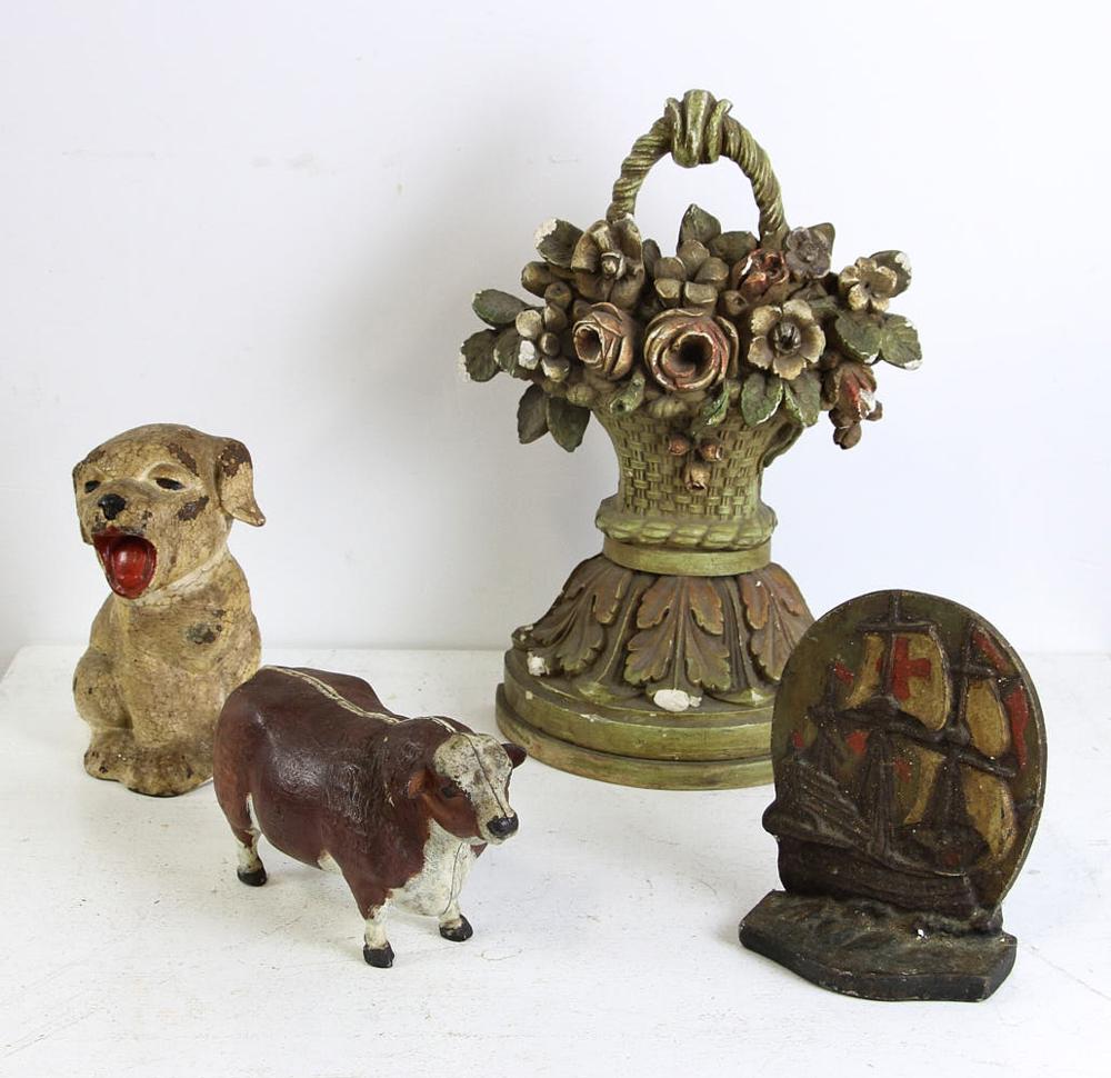 Cast Iron and Plaster Doorstops: Three cast iron doorstops and one plaster doorstop.