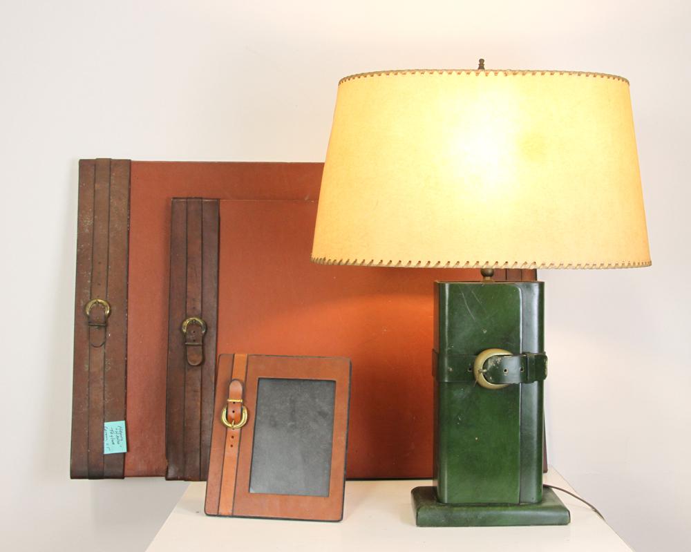 Group of Handmade Leather Items: Group of four handmade leather items made by Henry Taylor, Connecticut, to include: two blotters, picture frame and a lamp with shade.