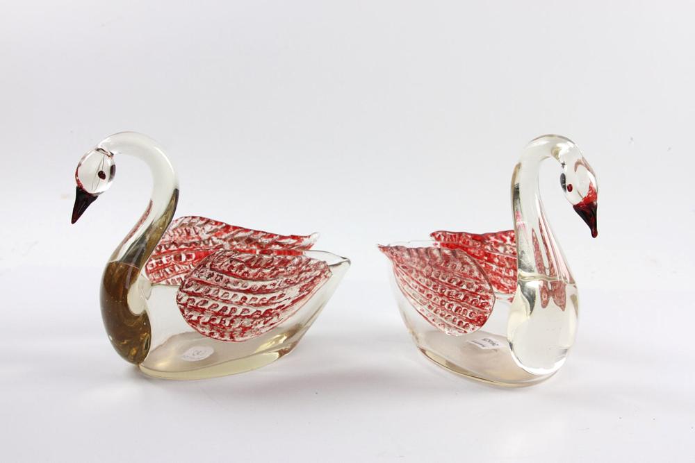 Pair of Czechoslovakia Clear Glass Swans: Pair of Czechoslovakia clear glass swans with red wings, 8" H x 8" W. Provenance: From The Warren Estate.