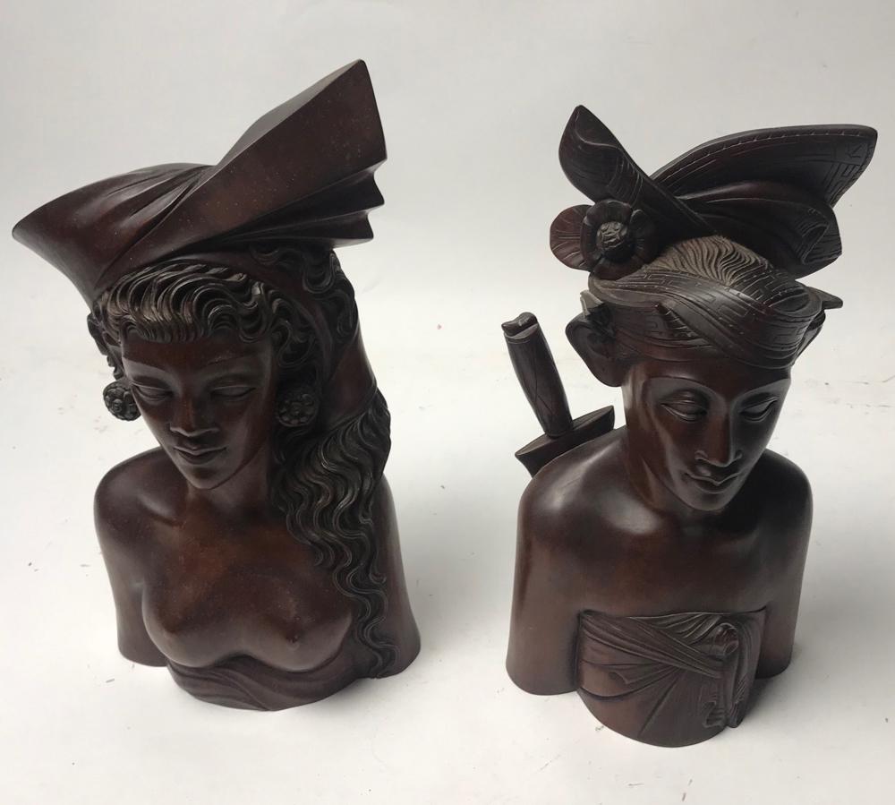 Pair of Mid Century Indonesian Carvings: Pair of mid-century Indonesian carvings of a man and a woman, tallest 14 1/2". Provenance: Arlington. Massachusetts collection.