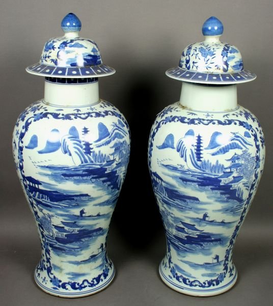 Pair of 20th C. Covered Blue and White Urns
