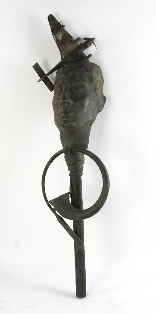 Bronze Sculpture of Mask, Plane and Horn: Bronze sculpture of mask, plane and horn, 34" H x 9" W. Provenance: From an Everett, Massachusetts estate.