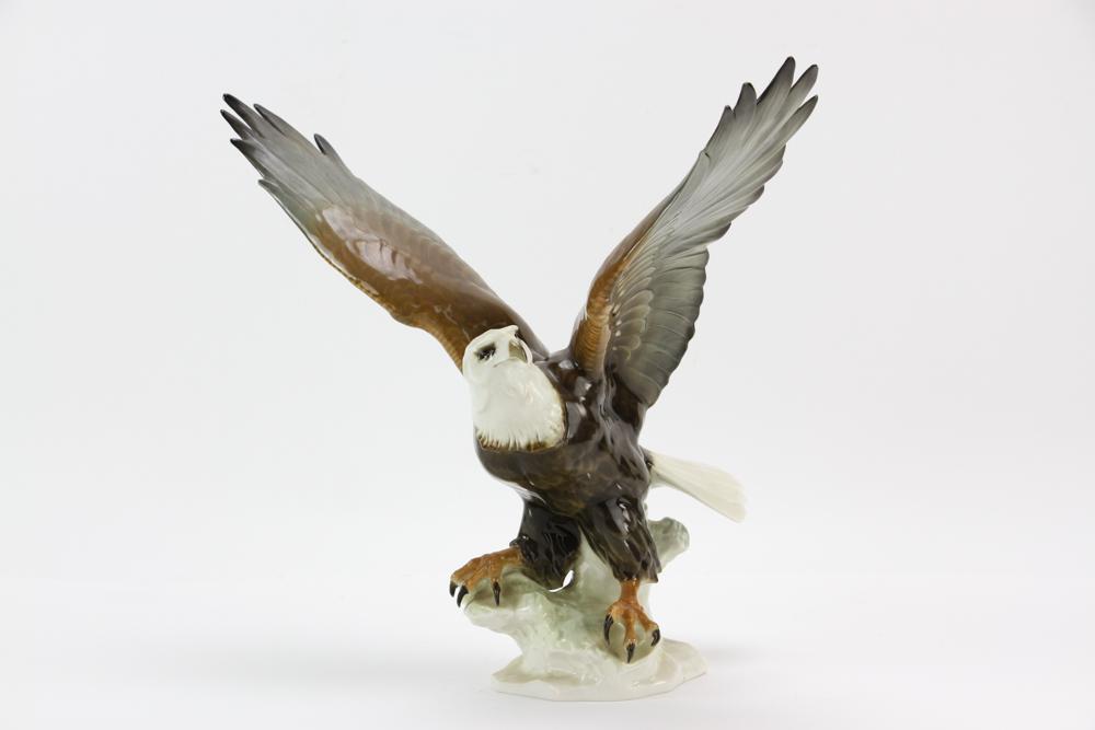 Lorenz Hutschenreuther American Bald Eagle Figurine: Lorenz Hutschenreuther American bald eagle figurine designed by Karl Tutter, green Hutschenreuther mark and incised K. Tutter mark under base, 13 1/2" x 15 1/4". Provenance: Cohasset, Massachusetts es
