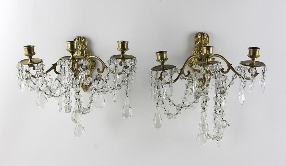 Pair of French Ormolu and Crystal Wall Sconces: Pair of French ormolu and crystal wall sconces, 11" H x 12" W x 8" D. Provenance: Mrs. Auto of Paris.