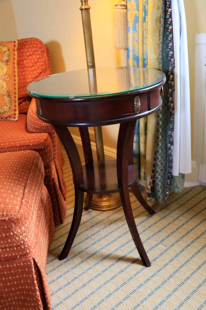 Circular mahogany table with inlaid pinwheel top, brass (1 of 1)