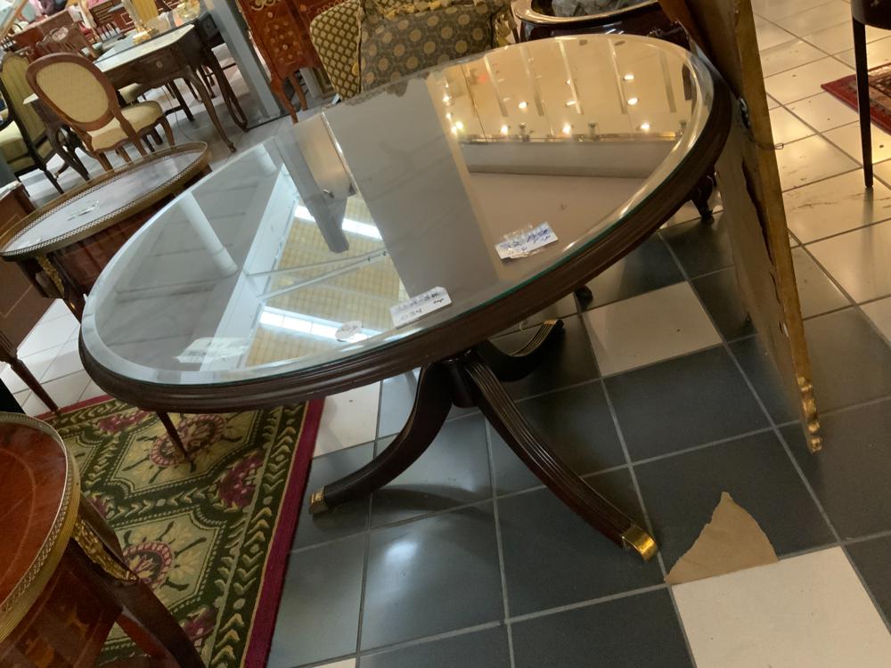 Duncan Phyfe Style Glass Top Center Table: Duncan Phyfe-style mahogany center table with beveled glass top, 30" H x 47" W.