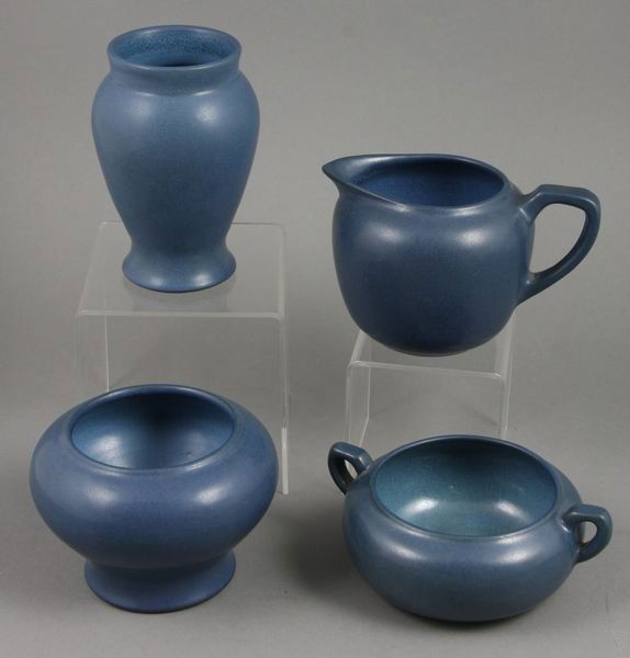 (4) Marblehead Pottery pcs Creamer Sugar etc.: Four (4) Marblehead Pottery blue pieces, including: creamer, 4" x 3 1/2"; sugar, 4 1/4" x 2"; vase, 4 1/2"; bowl, 3 1/4". Incised marks, vase has sticker. Good condition.