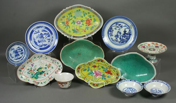 Twelve (12) 19/20th C. Chinese Ceramic Items: Assorted lot of twelve (12) 19th and 20th Century Chinese ceramic items, including: (6) footed polychrome serving dishes; dragon tea cup; (5) blue and white plates and bowls. Largest 12" x 9". Small r