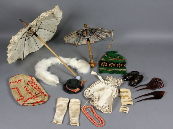 Assorted Fashion Doll Accessories: Assorted fashion doll accessories, including (2) celluloid hair combs, black velvet hat, twill duffle type bag, green crochet purse, apron with hand drawn ink detail, silk mitts, coral beads, (6) gold