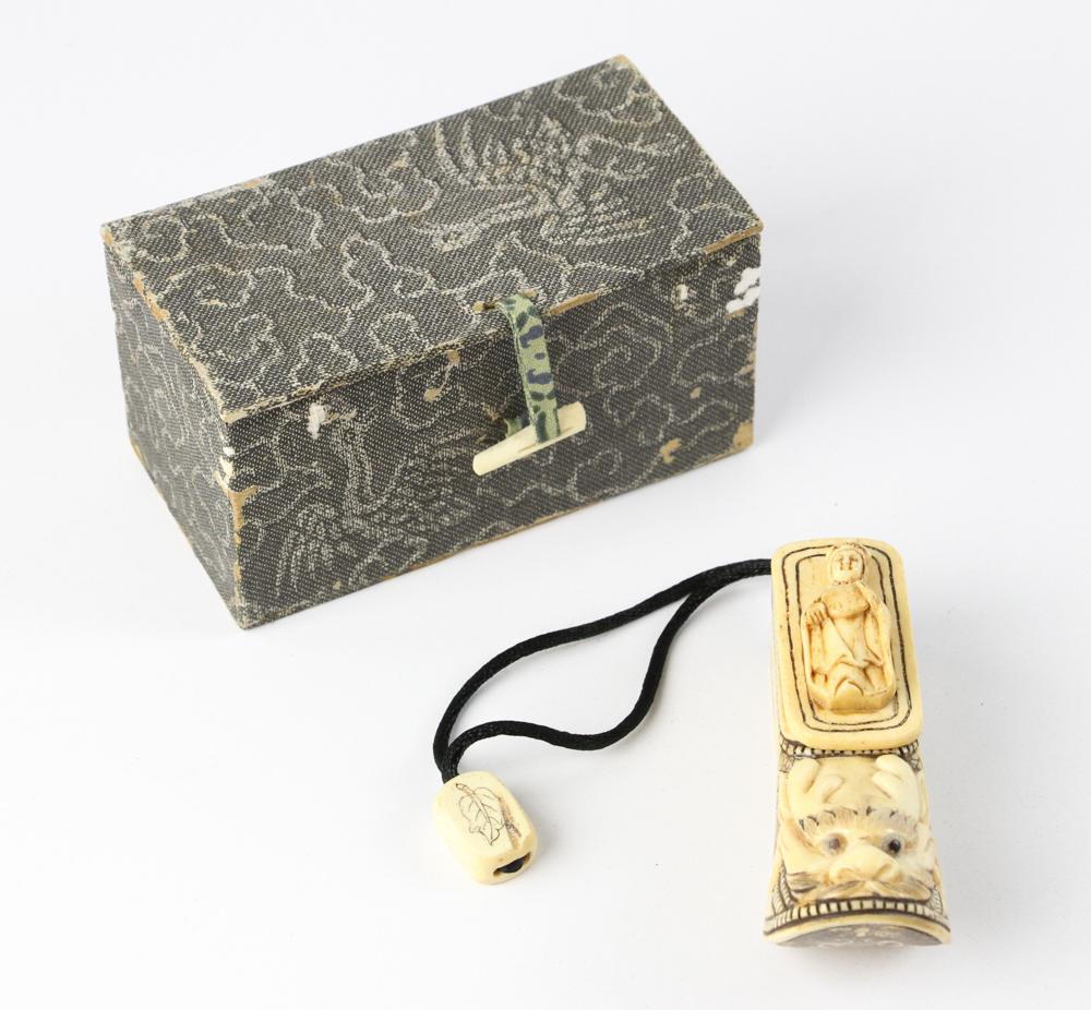 Antique Japanese Carved Bone Dragon: Antique Japanese carved bone dragon on form in form of a shoe, from the estate of the late Beverley Jackson of Santa Barbara, California.