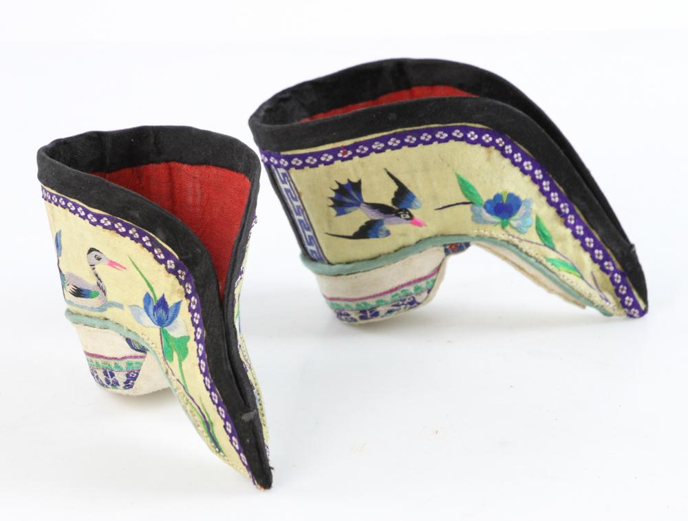 Pairs of Chinese Embroidered Silk Shoes for Bound Feet: Pair of late 19th/early 20th century Chinese embroidered silk shoes for bound feet, pictured on page 7 of 'Splendid Slippers' by Beverley Jackson, 3 1/2" long. Provenance: From the collection of the l