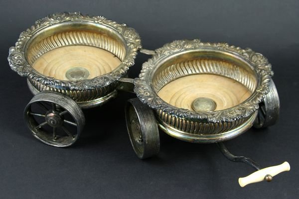 19th C. Champagne Caster Cart w/ Ivory Handle: 19th Century Sheffield silver plate on copper champagne caster cart with ivory handle, 16"l. x 4"h. x 7"w. Good condition.