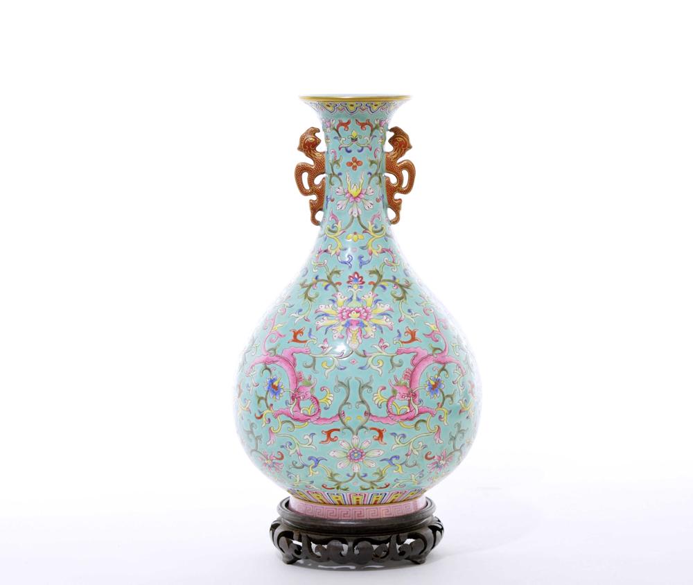 A Fine Chinese Famille Rose Porcelain Vase: The well-potted pear-shape body rising from a short splayed foot to a tall waisted neck and flaring rim, the neck flanked by a pair of iron-red Chilong-dragon handles with gilt highlights, each side o