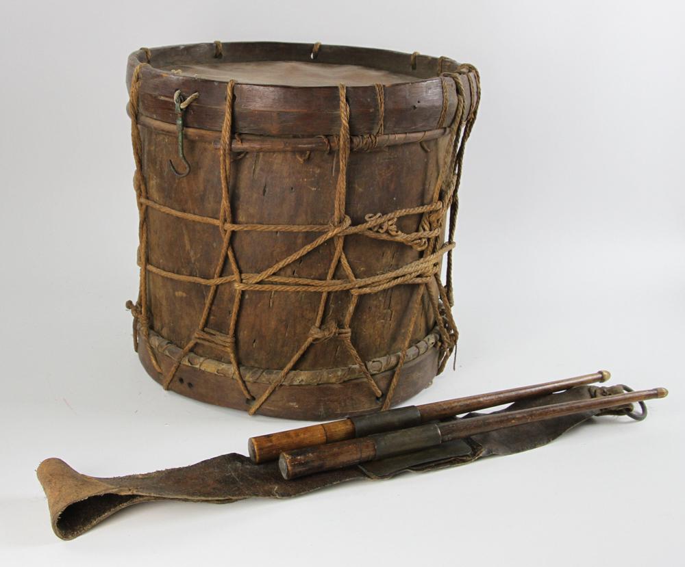 17th C American Hollowed Log Military Drum: A spectacular American 17th century military drum made from a thinned hollow log, 13" x 14". With it, was found the original deerskin drum sling, a brass gorget complete with two ferrules which house