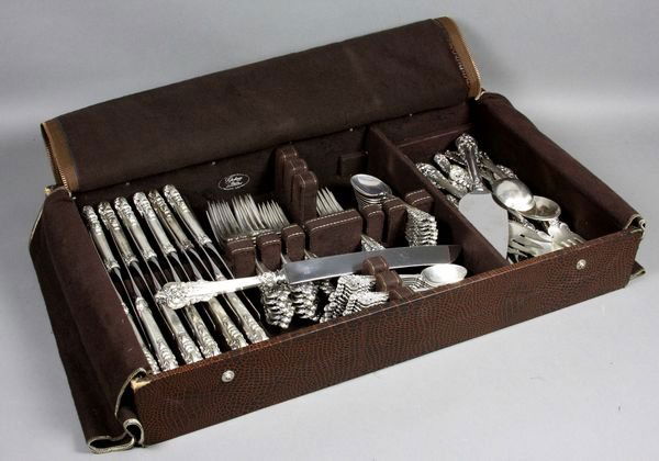 Wallace "Grande Baroque" Sterling Flatware: Wallace Silversmiths "Grande Baroque" sterling silver flatware partial service for (12), to include: (12) dinner knives with stainless blades; (10) butter spreaders; (12) dinner forks; (12) salad fork