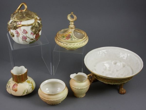 (6) pcs 19/20th C. Royal Worcester Blush Ivory: Collection of six (6) assorted late 19th/early 20th Century Royal Worcester blush ivory pieces, to include: paw-footed low bowl, 3 3/8"h. x 7 3/8"dia.; floral decorated vase, 3"h.; figural leaf covere